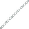 Thumbnail Image 0 of Previously Owned - 0.10 CT. T.W. Diamond Infinity Ribbon Link Bracelet in Sterling Silver - 7.25"