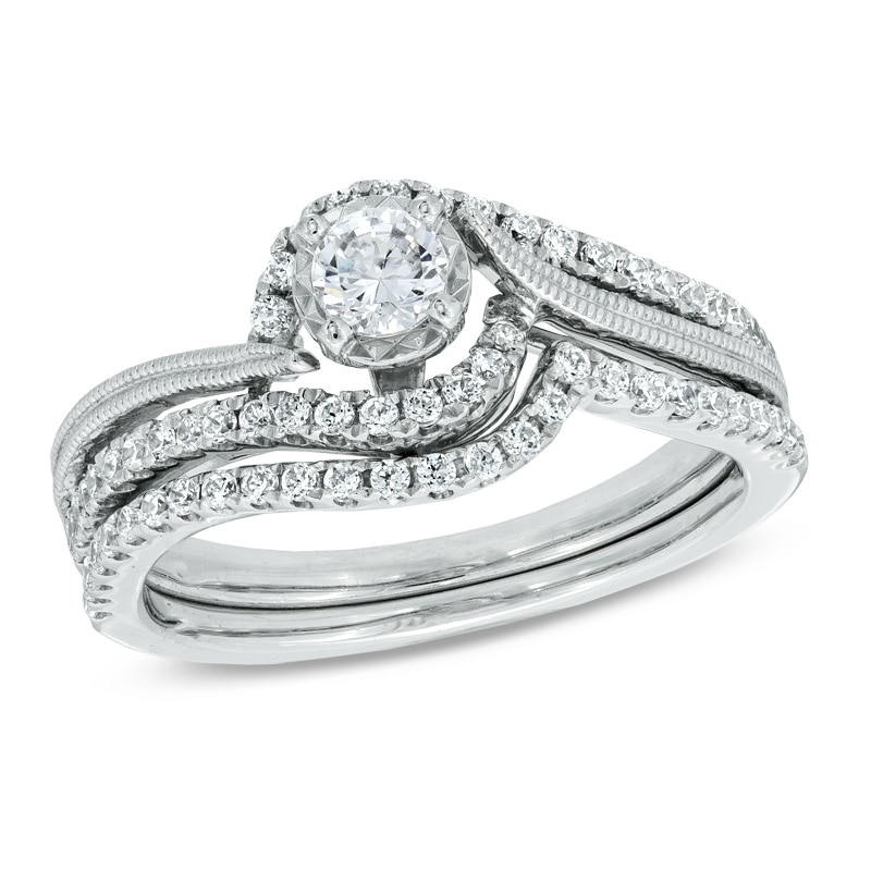 Previously Owned - 0.50 CT. T.W. Diamond Frame Swirl Bridal Set in 10K White Gold