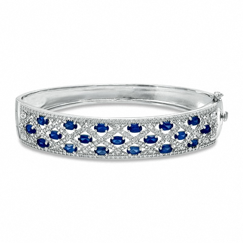 Previously Owned - Oval Lab-Created Blue Sapphire and Diamond Accent Bangle in Sterling Silver - 7.25"
