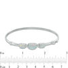 Thumbnail Image 1 of Previously Owned - Oval Lab-Created Opal and White Sapphire Three Stone Bangle in Sterling Silver