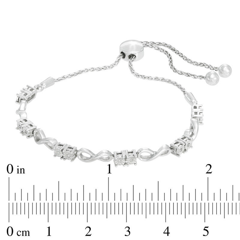 Previously Owned - 0.05 CT. T.W. Diamond Two-Stone Infinity Bolo Bracelet in Sterling Silver