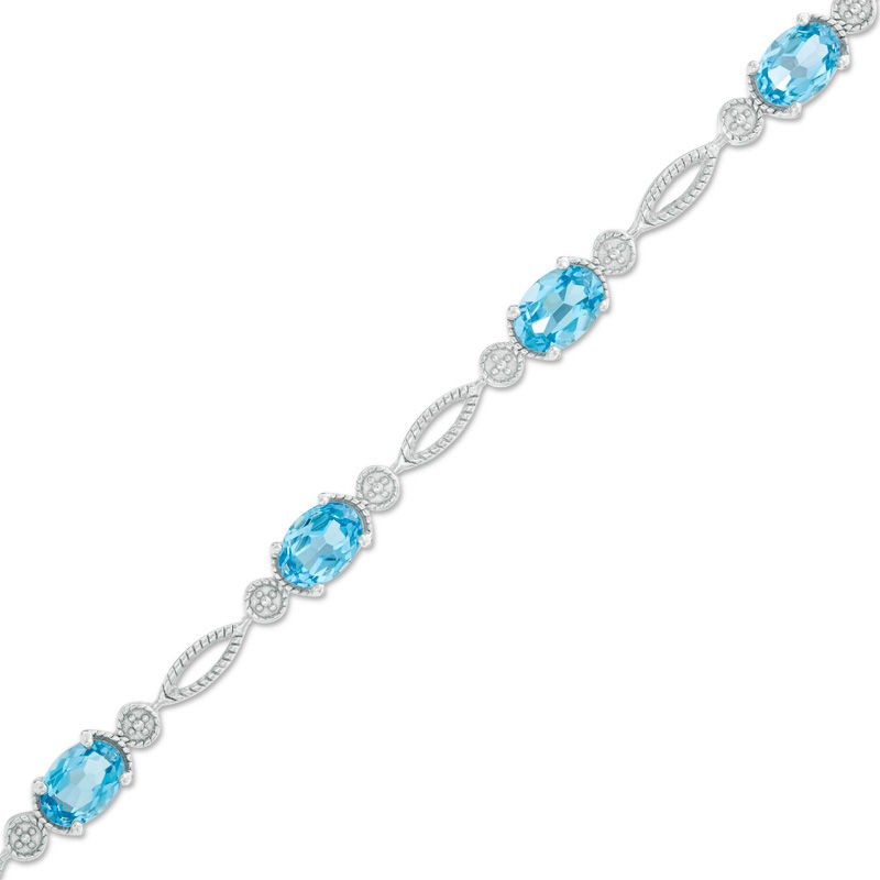 Previously Owned - Oval Swiss Blue Topaz Rope Bracelet in Sterling Silver