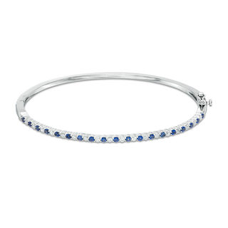 Previously Owned - Alternating Lab-Created Blue and White Sapphire Bangle in Sterling Silver