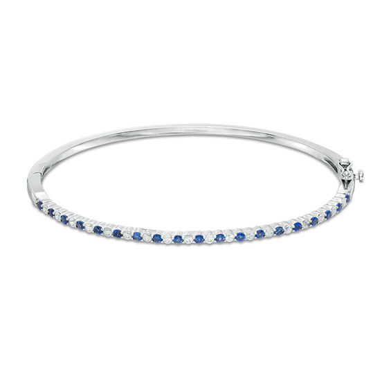 Previously Owned - Alternating Lab-Created Blue and White Sapphire Bangle in Sterling Silver