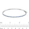 Thumbnail Image 1 of Previously Owned - Alternating Lab-Created Blue and White Sapphire Bangle in Sterling Silver