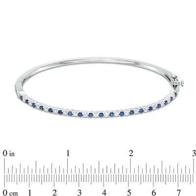 Previously Owned - Alternating Lab-Created Blue and White Sapphire Bangle in Sterling Silver