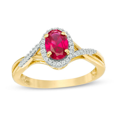 Previously Owned - Oval Lab-Created Ruby and 0.13 CT. T.W. Diamond Frame Split Shank Ring in 10K Gold