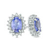 Thumbnail Image 0 of Previously Owned - Oval Tanzanite and 0.16 CT. T.W. Diamond Starburst Frame Stud Earrings in Sterling Silver