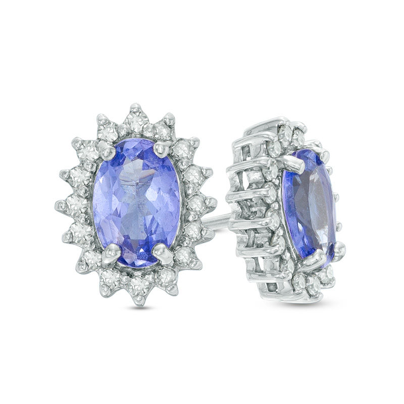 Previously Owned - Oval Tanzanite and 0.16 CT. T.W. Diamond Starburst Frame Stud Earrings in Sterling Silver