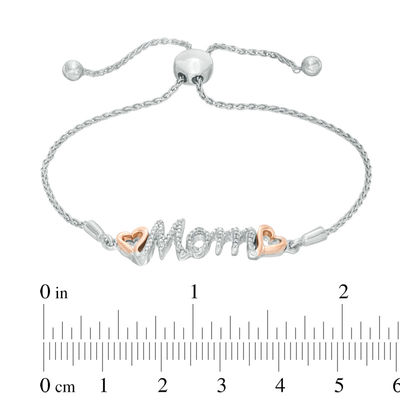 Previously Owned - 0.05 CT. T.W. Diamond Double Heart "Mom" Bolo Bracelet in Sterling Silver and 10K Rose Gold - 9.5"