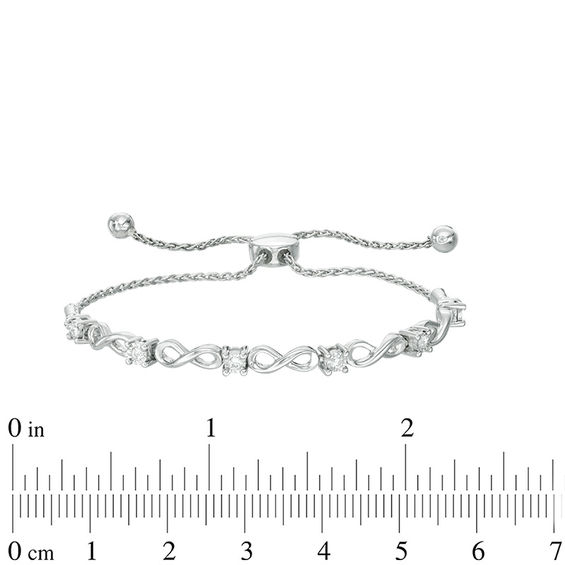 Previously Owned - 0.16 CT. T.W. Diamond Infinity Bolo Bracelet in 10K White Gold - 9.5"