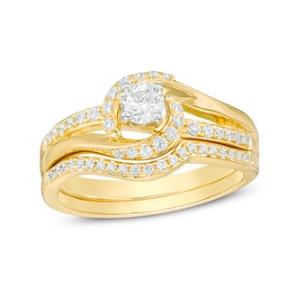 Previously Owned - 0.50 CT. T.W. Diamond Swirl Bypass Bridal Set in 14K Gold