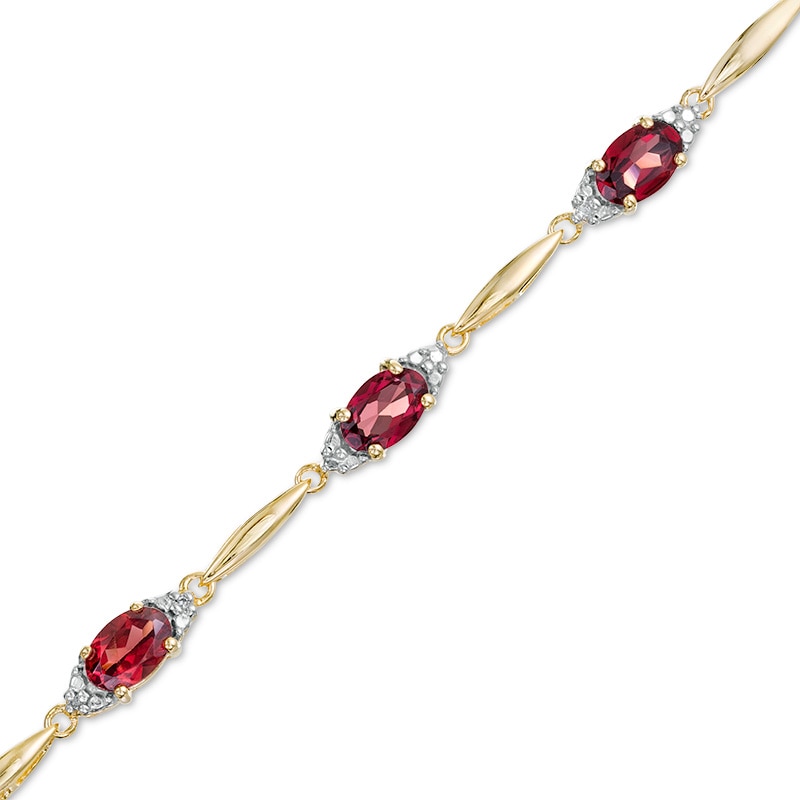 Previously Owned - Oval Garnet and Diamond Accent Bracelet in Sterling Silver with 10K Gold Plate - 7.25"|Peoples Jewellers