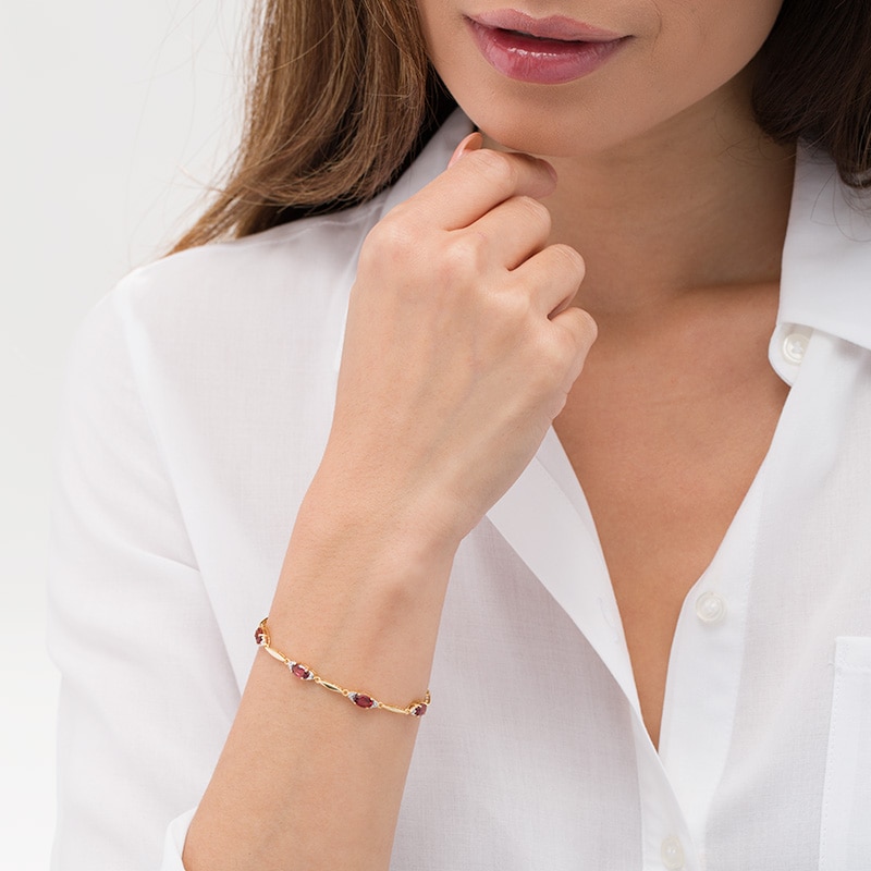 Main Image 2 of Previously Owned - Oval Garnet and Diamond Accent Bracelet in Sterling Silver with 10K Gold Plate - 7.25&quot;