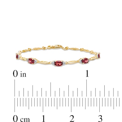 Previously Owned - Oval Garnet and Diamond Accent Bracelet in Sterling Silver with 10K Gold Plate - 7.25"