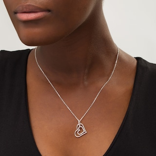 Previously Owned - Vera Wang Love Collection 0.15 CT. T.W. Diamond Interlocking Heart Necklace in Sterling Silver - 19"