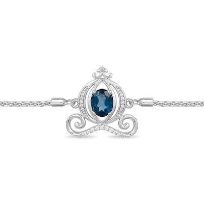 Previously Owned - Enchanted Disney Cinderella Oval Blue Topaz and 0.085 CT. T.W. Diamond Carriage Bolo Bracelet