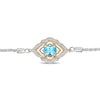 Previously Owned - Enchanted Disney Aladdin Oval Swiss Blue Topaz and 0.065 CT. T.W. Diamond Bolo Bracelet