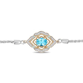 Previously Owned - Enchanted Disney Aladdin Oval Swiss Blue Topaz and 0.065 CT. T.W. Diamond Bolo Bracelet