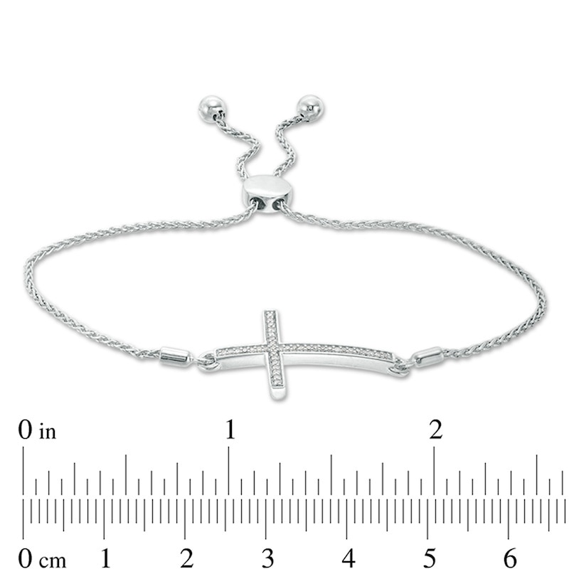Previously Owned - 0.10 CT. T.W. Diamond Sideways Cross Bolo Bracelet in Sterling Silver - 9.5"