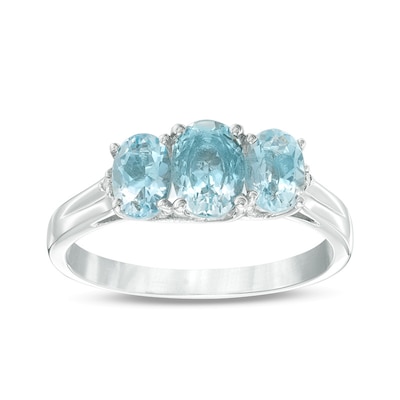 Previously Owned - Oval Aquamarine and Diamond Accent Three Stone Ring in 10K White Gold