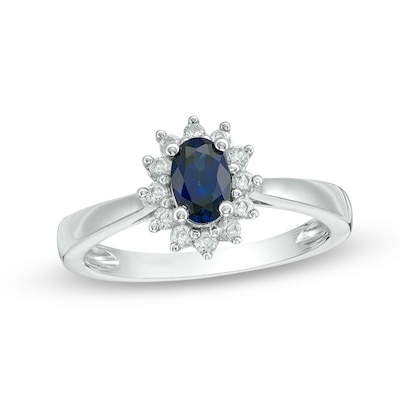 Previously Owned - Oval Blue Sapphire and 0.18 CT. T.W. Diamond Starburst Frame Ring in 10K White Gold