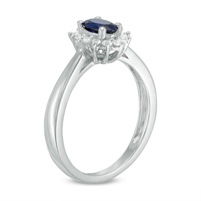 Previously Owned - Oval Blue Sapphire and 0.18 CT. T.W. Diamond Starburst Frame Ring in 10K White Gold