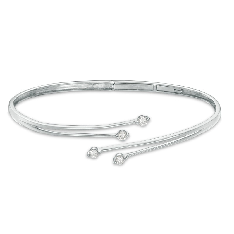 Previously Owned - 0.33 CT. T.W. Diamond Four Stone Bypass Bangle in 10K White Gold|Peoples Jewellers