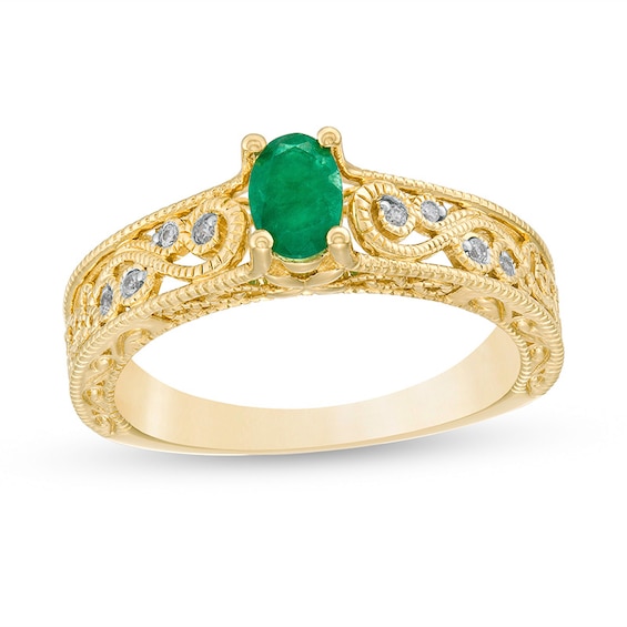 Previously Owned - Oval Emerald and 0.05 CT. T.W. Diamond Scroll Open Shank Vintage-Style Ring in 10K Gold