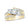 Previously Owned - 0.75 CT. T.W. Diamond Past Present Future® Three Stone Bypass Engagement Ring in 10K Gold