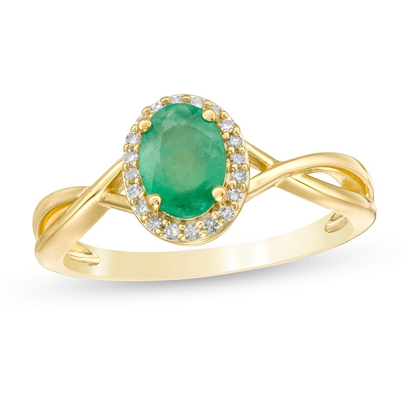 Previously Owned - Oval Emerald and 0.08 CT. T.W. Diamond Frame Twist Shank Ring in 10K Gold