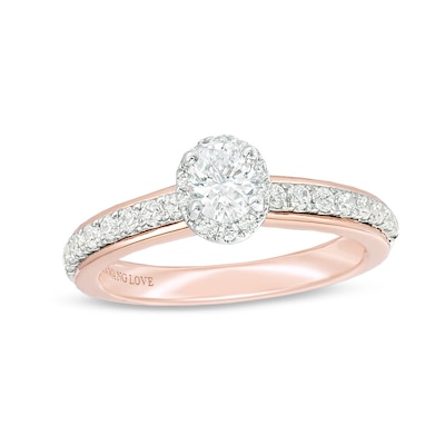 Previously Owned - Vera Wang Love Collection 0.60 CT. T.W. Oval Diamond Frame Engagement Ring in 14K Two-Tone Gold