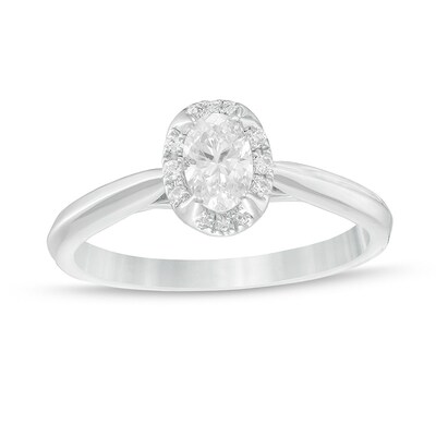 Previously Owned - 0.62 CT. T.W. Oval Diamond Frame Engagement Ring in 14K White Gold (I/I2)