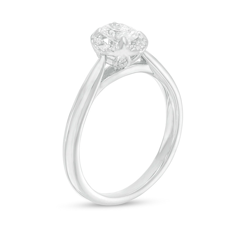Previously Owned - 0.62 CT. T.W. Oval Diamond Frame Engagement Ring in 14K White Gold (I/I2)|Peoples Jewellers
