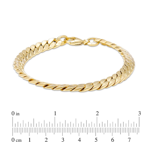 Previously Owned - Italian Gold 7.0mm Flat Curb Chain Link Bracelet in 18K Gold - 7.26"