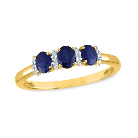 Previously Owned - Oval Blue Sapphire and 0.08 CT. T.W. Diamond Three Stone Ring in 14K Gold