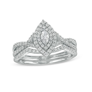 Previously Owned - 0.58 CT. T.W. Marquise Diamond Double Frame Twist Shank Bridal Set in 10K White Gold (I/I2)