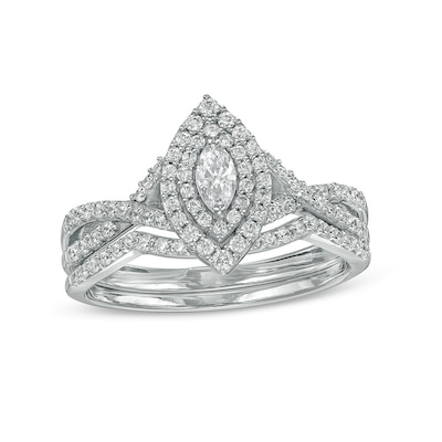 Previously Owned - 0.58 CT. T.W. Marquise Diamond Double Frame Twist Shank Bridal Set in 10K White Gold (I/I2)