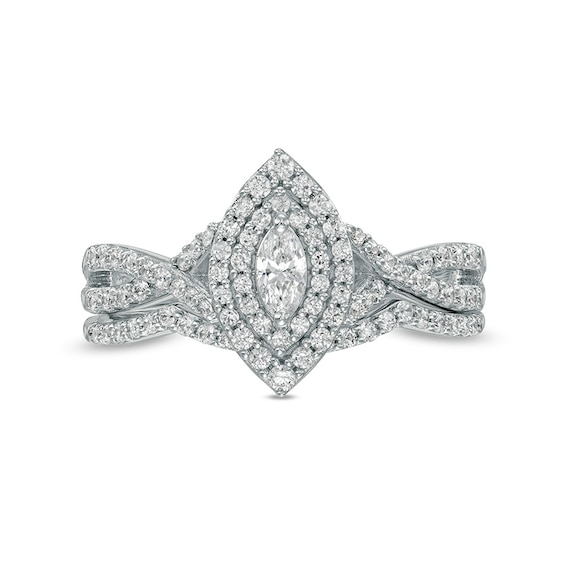 Previously Owned - 0.58 CT. T.W. Marquise Diamond Double Frame Twist Shank Bridal Set in 10K White Gold (I/I2)