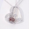 4.0mm Heart-Shaped Garnet and Diamond Accent Tilted "LOVE" Pendant in Sterling Silver