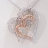 Unstoppable Love™ Diamond Accent Tilted Double Heart Pendant in Sterling Silver and 10K Rose Gold