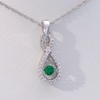 Unstoppable Love™ Lab-Created Emerald and 0.15 CT. T.W. Diamond Twist Teardrop Pendant in 10K White Gold