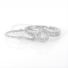 0.29 CT. T.W. Diamond Bypass Swirl Bridal Set in 10K White Gold