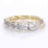 0.95 CT. T.W. Diamond Three Stone Braid Engagement Ring in 10K Gold