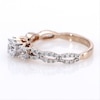 0.95 CT. T.W. Diamond Three Stone Braid Engagement Ring in 10K Rose Gold