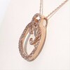 Lab-Created White Sapphire and 0.20 CT. T.W. Diamond Spiral Circle Pendant in 10K Rose Gold