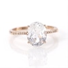 Oval Lab-Created White Sapphire and 0.04 CT. T.W. Diamond Ring in 10K Rose Gold