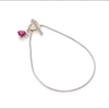 6.0mm Heart-Shaped Lab-Created Ruby and White Sapphire Paw Print Toggle Bracelet in Sterling Silver and 10K Gold - 7.25"