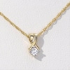 CT. T.W. Diamond Solitaire Crossover Pendant and Stud Earrings Set in 10K Gold