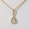 CT. T.W. Diamond Solitaire Teardrop Flame Pendant and Stud Earrings Set in 10K Gold